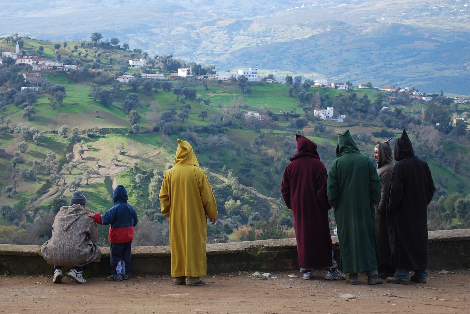 Men in Djellabas, Chefchaouen souk, Morocco.jpg